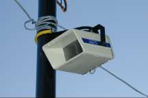 An infernal machine hanging on a post