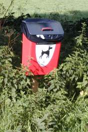A red dog bin