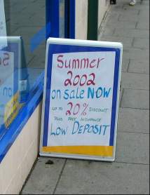 Sign saying: Summer 2002 for sale